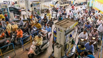 People queue up at a petrol pump in large numbers amid rumours of fuel shortage in the wake of the West Asia conflict, in Hyderabad, Telangana. File/PTI