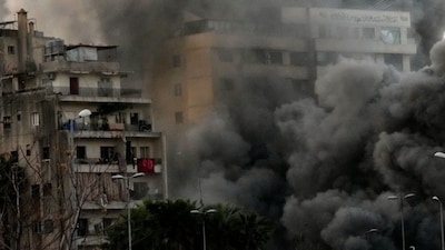 Smoke rises from a building hit by a targeted Israeli strike in central Beirut, Lebanon, March 12, 2026. AP