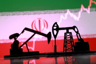 FILE PHOTO: 3D-printed oil pump jacks, Iranian flag, and a rising stock graph appear in this illustration taken March 2, 2026. REUTERS/Dado Ruvic/Illustration/File Photo