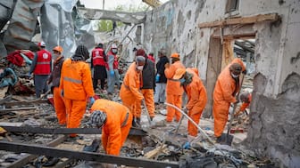 Volunteers clear the debris at the site of a drug rehabilitation hospital destroyed in what the Taliban said was a Pakistani air strike in Kabul. Reuters