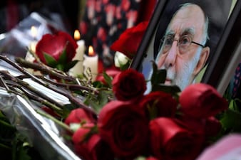 This photograph taken on March 3, 2026, shows a makeshift memorial with flowers and a portrait of late Iran's supreme leader Ayatollah Ali Khamenei outside the Iranian Embassy in Bishkek on March 3, 2026. (Photo by Vyacheslav OSELEDKO / AFP)