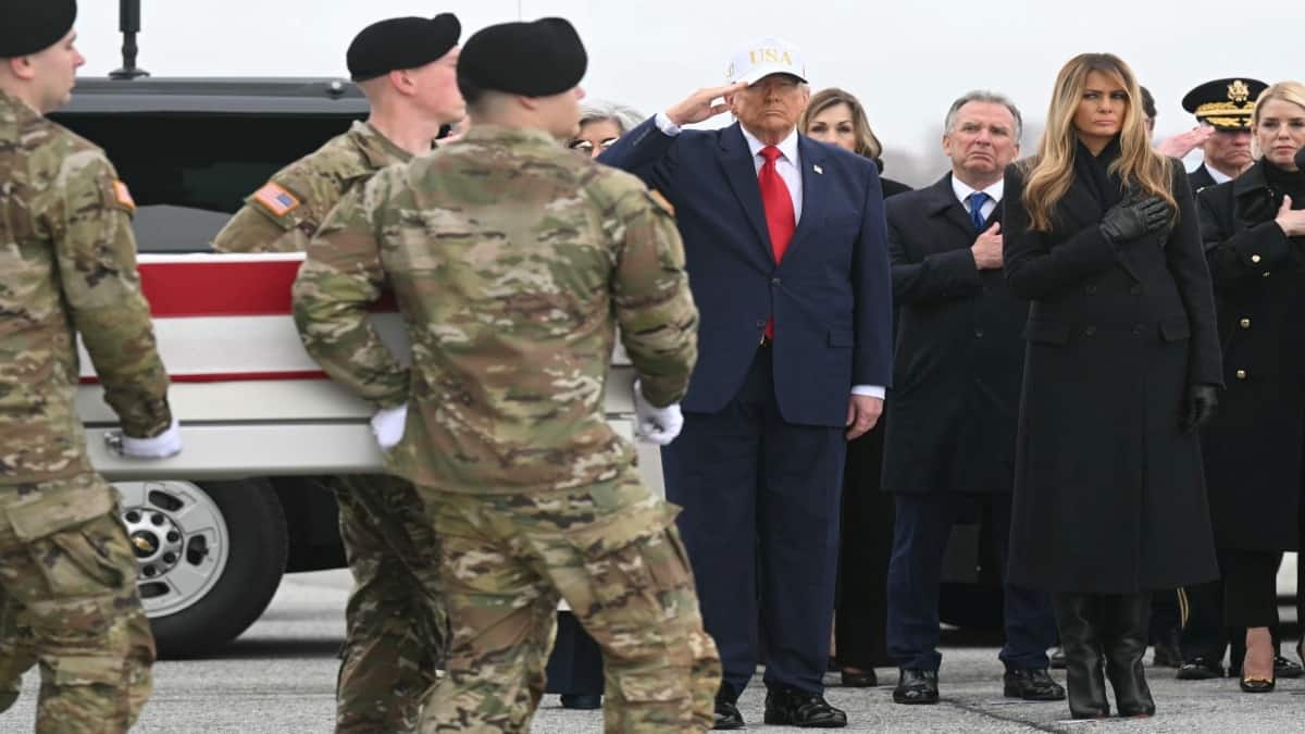 With a 'USA' cap on his head, Trump attends return of first US troops killed in Iran war
