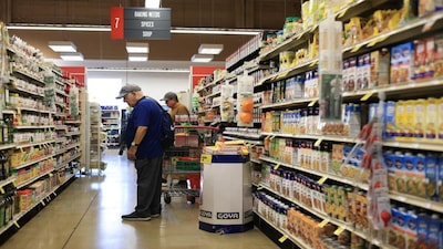 Customers shop in a grocery store in Miami, Florida. (File/AFP)