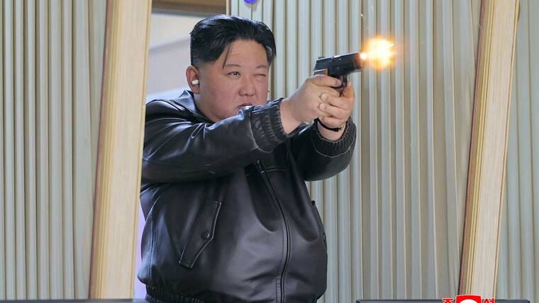 North Korean leader Kim Jong Un test-firing a new pistol at a shooting gallery at an important munitions factory under the Second Economic Committee, at an undisclosed location in North Korea. AFP