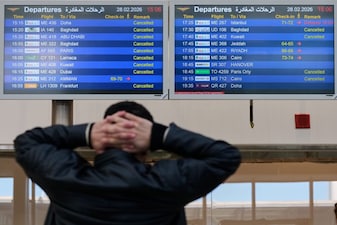 A traveller checks departure times as many flights are cancelled at Beirut Rafik Hariri International Airport in Beirut, Lebanon as many airlines canceled flights due to the conflict involving the United States, Israel and Iran. AP