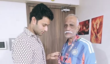 Shivam Dube presented his T20 World Cup-winning medal to his father Rajesh who has been his coach. Instagram/ShivamDube