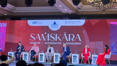 Carla Sands (first guest from left in red), the Chair of the Foreign Policy Initiative at the America First Policy Institute, garnered laughter and booing from the audience at a session at Raisina Dialogue 2026 at Delhi on March 06, 2026. (Photo: Firstpost) 