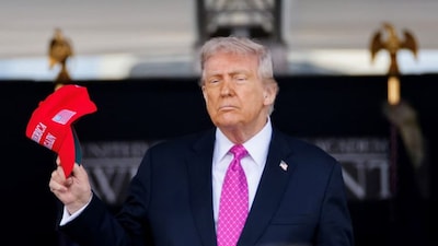 US President Donald Trump holds a 'Make America Great Again' (Maga) hat as he attends the commencement ceremony at West Point Military Academy in West Point, New York, US, May 24, 2025. (Photo: Reuters) 