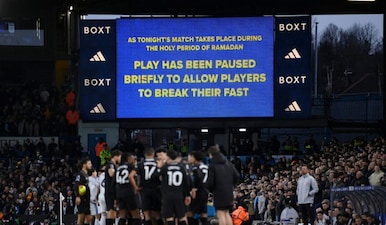 The big screen displays a message as play stops during Leeds vs City to allow players to break their fast for Ramadan. Reuters
