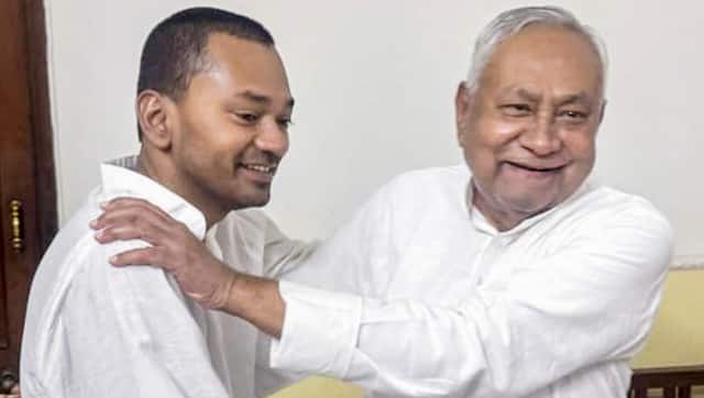 Bihar Chief Minister Nitish Kumar, right, greets his son Nishant Kumar as he joins the Janata Dal (United) JD(U) in Patna, Bihar. PTI