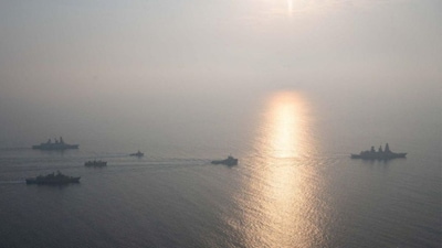 Military vessels escort tugboats as they sail towards the damaged Greek-flagged oil tanker Sounion after an attack by Houthi militants, on the Red Sea, September 14, 2024 in this handout image. File Image/EUNAVFOR ASPIDES via Reuters