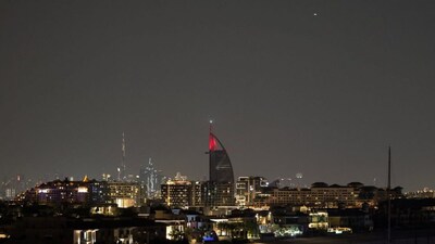 A projectile (Top-R) streaks accross the sky over Dubai on March 5, 2026.- AFP