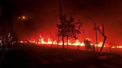 This video grab taken from UGC images posted on social media on March 7 and 8, 2026 shows fire erupting at an oil depot in Iran's capital Tehran.- AFP