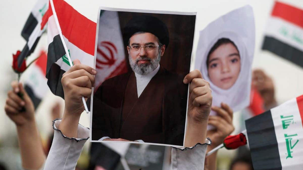 A schoolgirl holds up a poster of Iran's new supreme leader Mojtaba Khamenei during an anti-US and Israel demonstration in Baghdad on March 12, 2026.- AFP