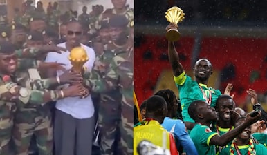 Senegal coach Pape Thiaw was seen with the Afcon trophy at a military base. Images: Topskills Sports UK/X/Reuters
