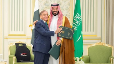 Saudi Crown Prince Mohammed bin Salman and Pakistan Prime Minister Shehbaz Sharif embrace each other on the day they sign a defence agreement, in Riyadh, Saudi Arabia, September 17, 2025. File Image/Saudi Press Agency via Reuters