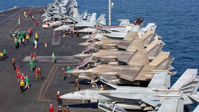Aircraft attached to Carrier Air Wing (CVW) 9 sit on the flight deck of the US Navy Nimitz-class aircraft carrier USS Abraham Lincoln in support of the Operation Epic Fury attack on Iran, February 28, 2026. File Image/US Navy via Reuters