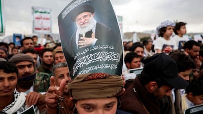 A protester with a poster on his head featuring a picture of late Iran's Supreme Leader Ayatollah Ali Khamenei joins a demonstration with Houthi supporters in solidarity with Iran and Lebanon, amid the US-Israeli conflict with Iran, in Sanaa, Yemen March 6, 2026. Reuters