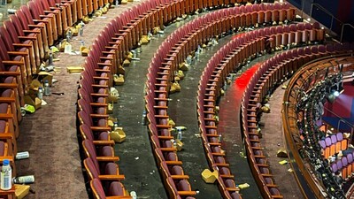 The picture shows rows of seats inside the Dolby Theatre littered with empty water bottles, snack packets, food wrappers, and other debris scattered across both the floor and seating areas. Photo credit: X/@NextBestPicture