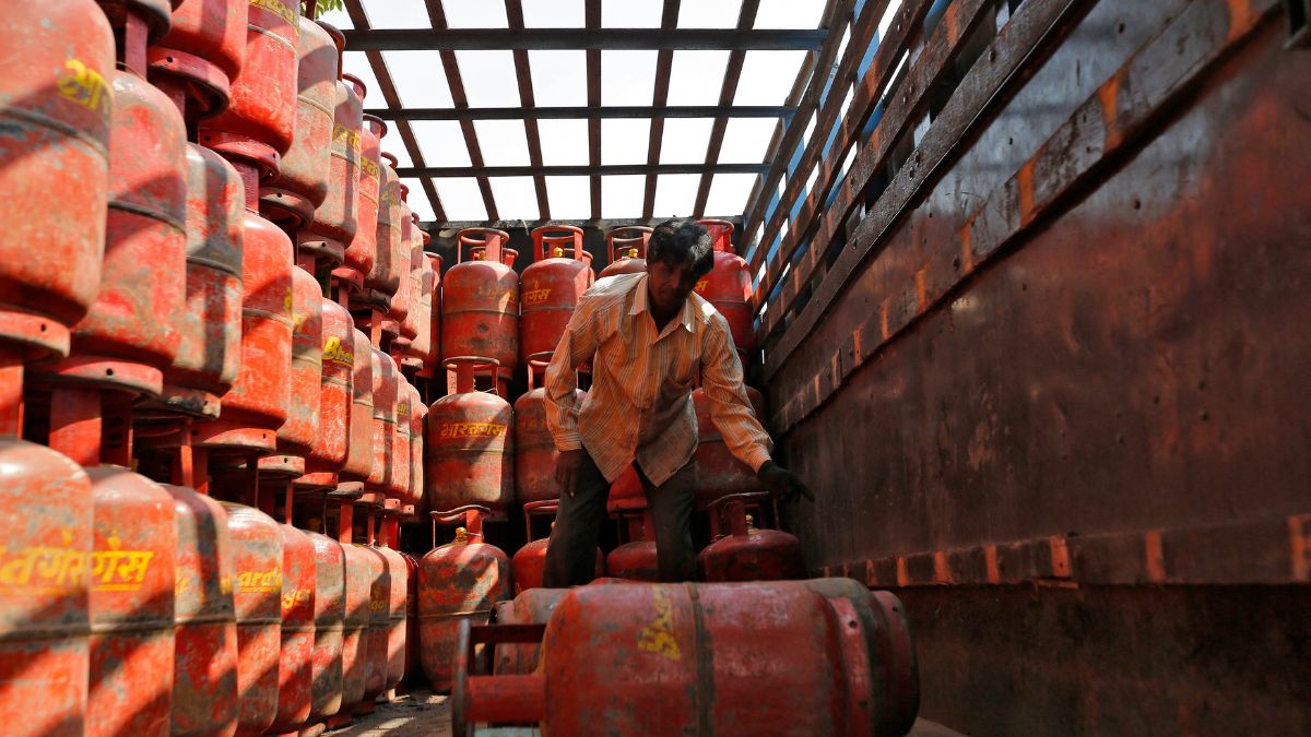 A worker unloads liquefied petroleum gas (LPG) cooking cylinders from a supply truck outside a distribution centre in the western Indian city of Ahmedabad. File image/Reuters A worker unloads liquefied petroleum gas (LPG) cooking cylinders from a supply truck outside a distribution centre in the western Indian city of Ahmedabad. File image/Reuters