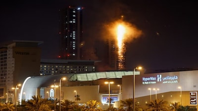 Smoke rises from a burning building hit by an Iranian drone strike, after Israel and the US launched strikes on Iran, in Seef district, Manama, Bahrain, February 28, 2026. Image: Reuters 