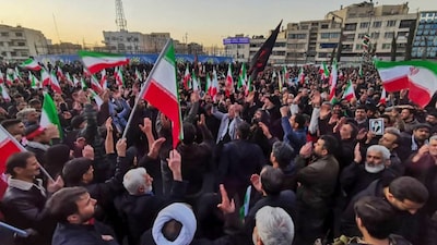 People mourn the death of Iran’s Supreme Leader Ayatollah Ali Khamenei, who was killed in joint US and Israeli strikes, in Tehran on March 1, 2026. (AFP)