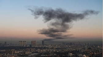 A plume of smoke rises near Erbil International Airport in Erbil on March 1, 2026. (AFP)