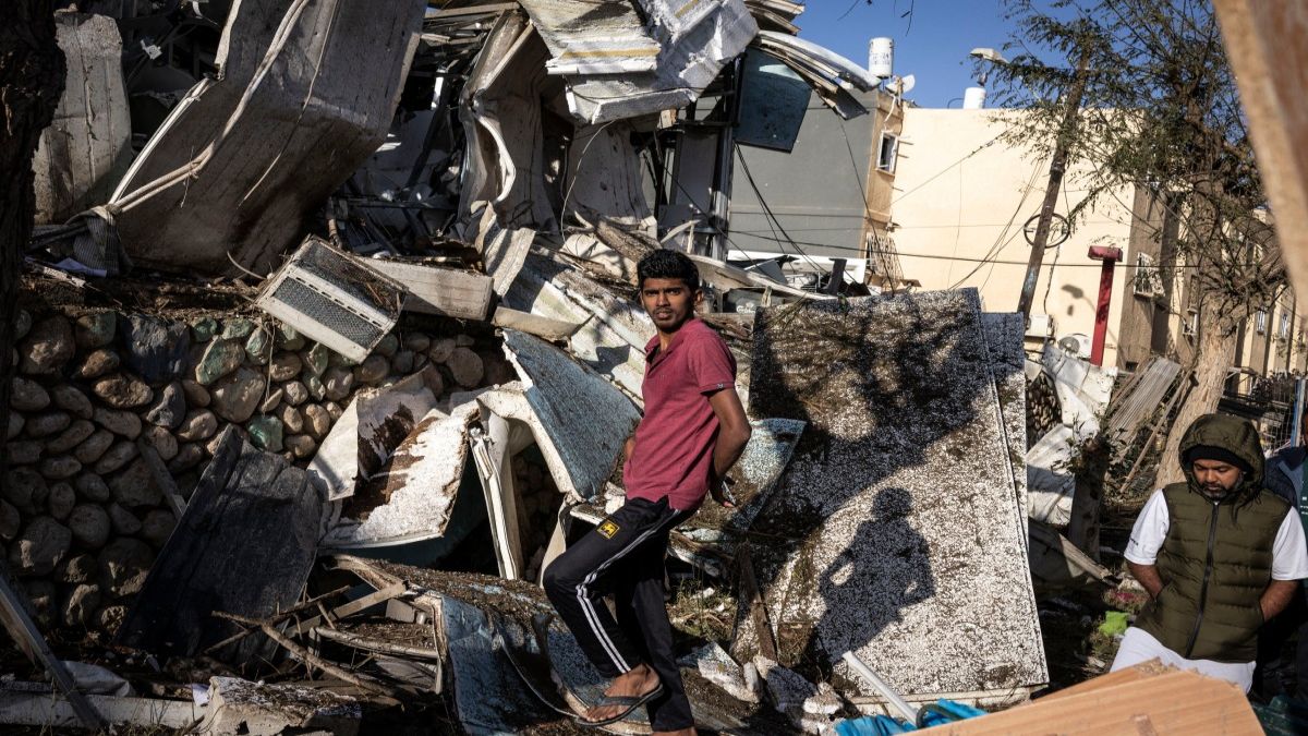 People inspect the site of an Iranian missile strike in Dimona. Iranian missile strikes on two southern Israeli towns wounded more than 100 people, medics said, after Israeli air defence systems failed to intercept the projectiles. AFP People inspect the site of an Iranian missile strike in Dimona. Iranian missile strikes on two southern Israeli towns wounded more than 100 people, medics said, after Israeli air defence systems failed to intercept the projectiles. AFP
