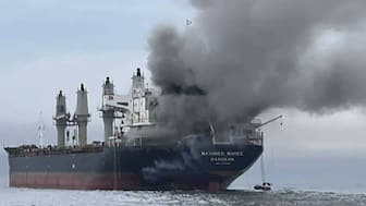 Smoke rising from the Thai bulk carrier 'Mayuree Naree' near the Strait of Hormuz after an attack. A Thai bulk carrier travelling in the crucial Strait of Hormuz was attacked on March 11, with 20 crew members rescued so far, the Thai navy said. AFP
