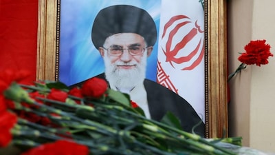 A portrait of Iran's late Supreme Leader Ayatollah Ali Khamenei, who was killed in Israeli and US strikes on Saturday, stands among flowers outside the Iranian Embassy in Moscow. Reuters