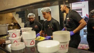Chefs prepare plates with biryani to serve customers inside Arsalan restaurant amid disruptions in commercial LPG supply following the US-Israeli conflict with Iran, in Kolkata, India, March 13, 2026. File Image/Reuters