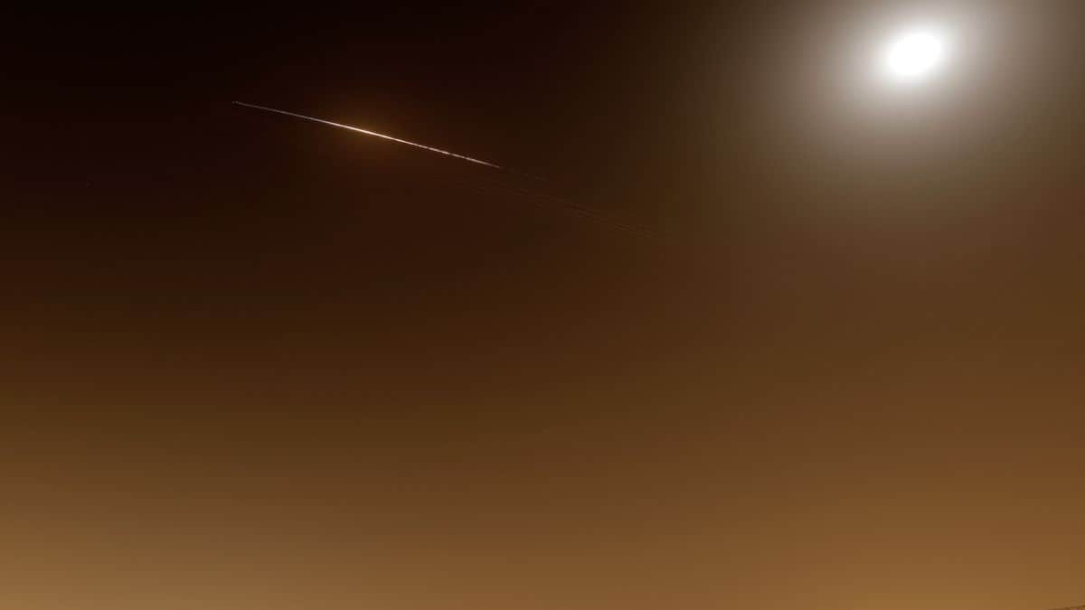 Rocket trails are seen in the sky above the Netanya, Israel, on April 4, 2026. - AFP