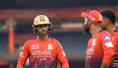 Phil Salt talks to Dinesh Karthik during RCB practice session. X/RCBTweets