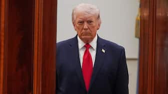United States President Donald Trump arrives from the Blue Room to speak about the Iran war from the Cross Hall of the White House on April 1, 2026, in Washington, DC, US. Image/Pool via Reuters