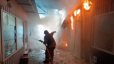In this handout photograph taken and released by the State Emergency Service of Ukraine on April 4, 2026, a firefighter puts out a fire at the market following a strike in Nikopol, amid the Russian invasion of Ukraine. (AFP)