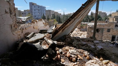 A residential building damaged by recent US-Israeli strikes is seen in Fardis, west of Tehran.  Donald Trump has said recently that the US could end its military attacks on Iran within two to three weeks. AP file