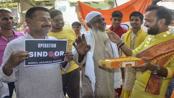 People celebrate the Indian Armed Forces' missile strikes on terror targets in Pakistan and Pakistan-occupied Kashmir (PoK) under 'Operation Sindoor', in retaliation to the Pahalgam terror attack, in Mirzapur. PTI