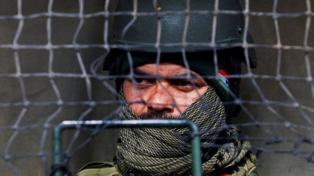Indian Central Reserve Police Force (CRPF) personnel looks out from a bunker. The authorities cracked the plan by questioning OGWs they had nabbed. Reuters