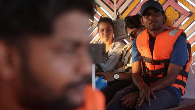 Tithi Chiranjeevi, an Indian seafarer who was stuck in Iran during the conflict, travels on a ferry in Mumbai. Reuters