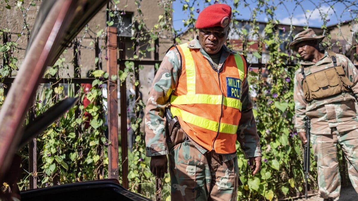 A South African National Defence Force (SANDF) soldier inspects a car outside a house during a joint operation with unseen South Africa Police Service (SAPS) officers in Westbury, Johannesburg (Representational image/AFP)