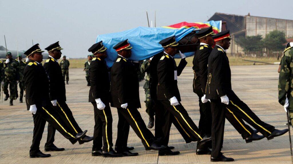 Guards of honour members carry a coffin that contains the only known remains, a tooth of the murdered Congolese independence hero Patrice Lumumba, after he was returned to his family by the Belgian government at Airport in Kinshasa, Democratic Republic of Congo June 27, 2022. File Image/Reuters