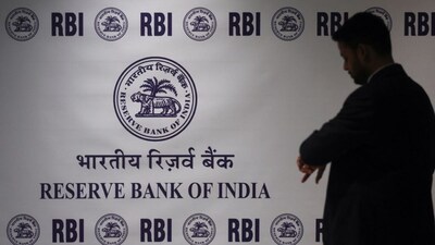 A man stands in front of the Reserve Bank of India (RBI) logo inside its headquarters in Mumbai, India, February 6, 2026. File Image/Reuters