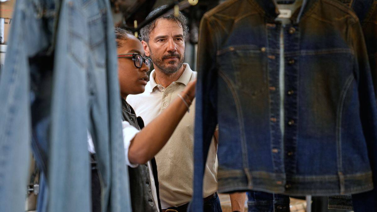 Bill Curtin, owner of BPD Washhouse, looks over some samples at his denim processing facility in Jersey