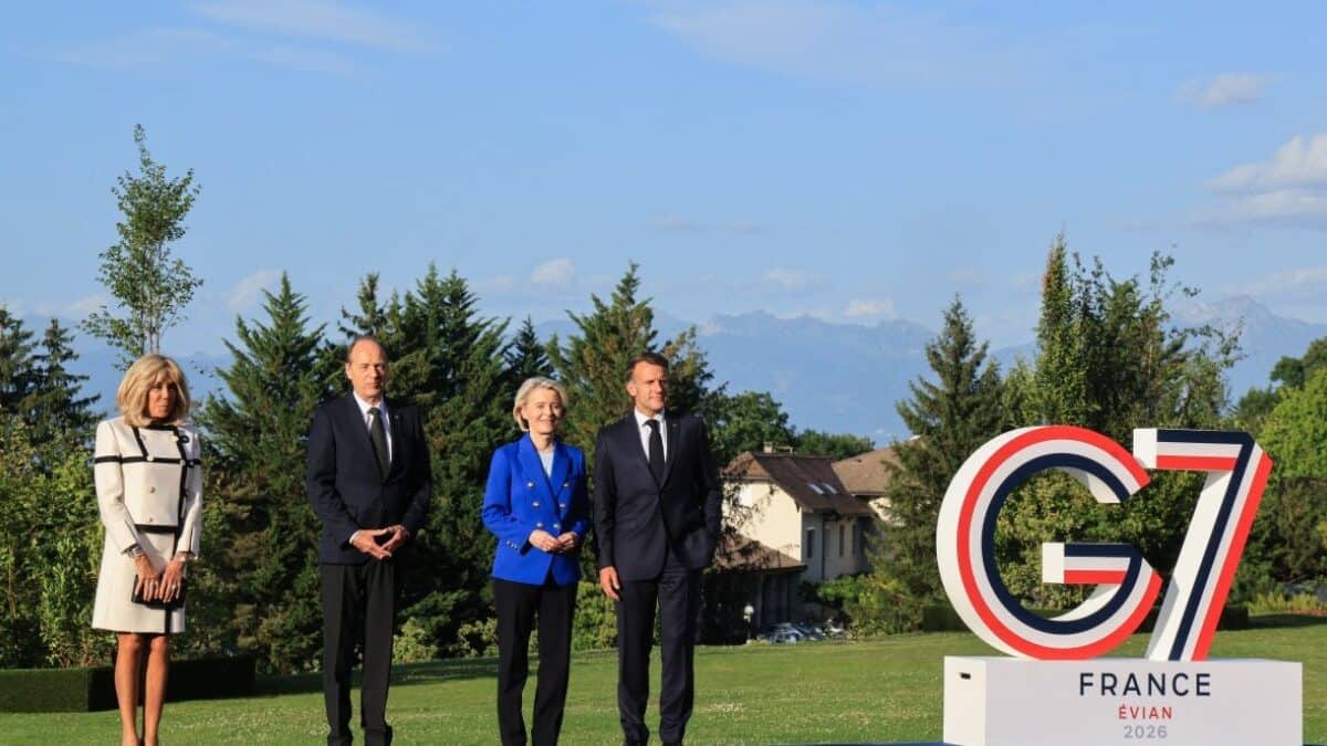 France's President Emmanuel Macron (R) and his wife Brigitte Macron (L) pose with European Commission President Ursula von der Leyen (C-R) and her husband Heiko during the official greeting as part of the G7 summit, in Evian, eastern France, on June 15, 2026. AFP