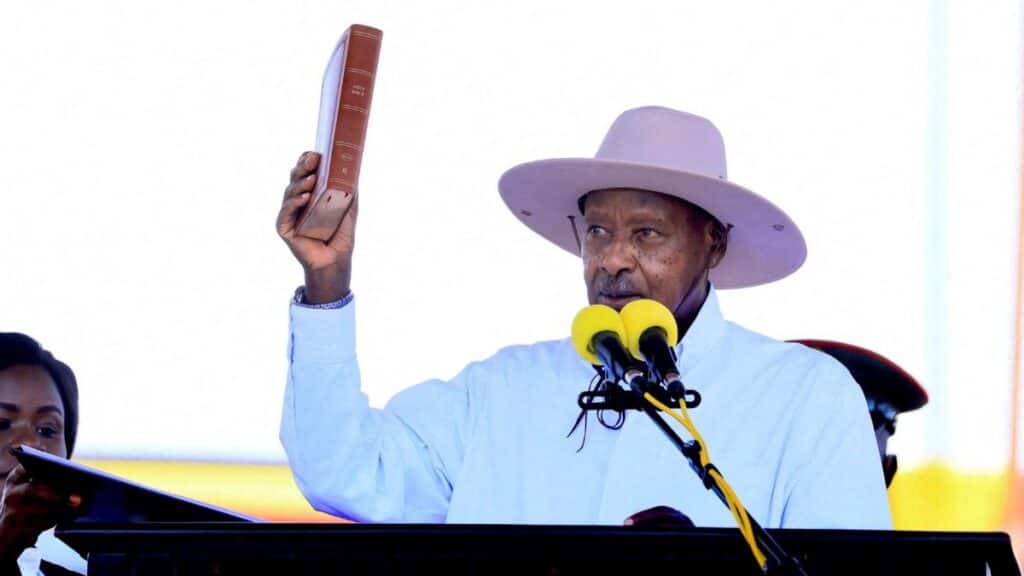 Uganda's President and leader of the ruling National Resistance Movement (NRM) party, Yoweri Museveni, holds up the Bible as he is sworn in after being declared the winner of the country's presidential election, extending his decades-long rule, at the Kololo grounds in Kampala, Uganda, May 12, 2026. File Image/Reuters