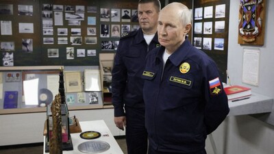 Russian President Vladimir Putin accompanied by Pacific fleet commander Viktor Liina tours a missile cruiser, 'Varyag', in Russia's far eastern Sakhalin Region on August 12, 2026. (Photo: Sputnik/Gavriil Grigorov/Pool via Reuters)