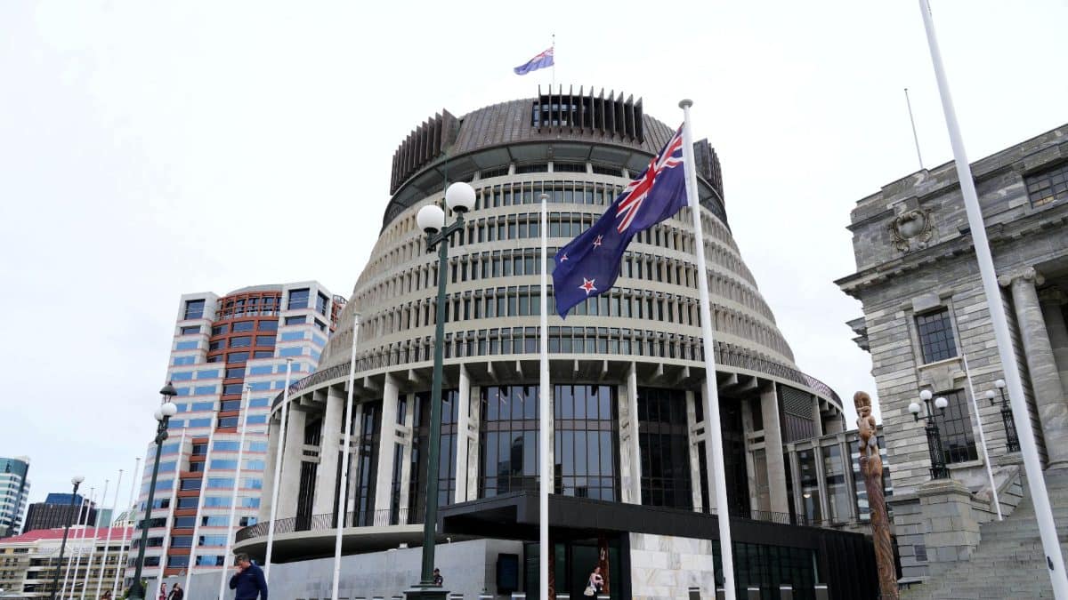 Why has New Zealand’s decision to make English an official language divided the nation?