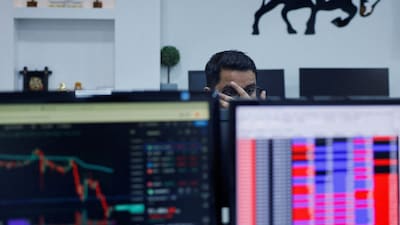 A broker reacts as he trades at his computer terminal inside a stock brokerage firm in Mumbai, India. File/Reuters