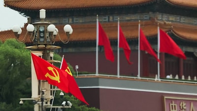 Flags of the Chinese Communist Party and the Lao People's Revolutionary Party fly next to the Tiananmen Gate in Beijing, China. Representative Photo: File/Reuters
