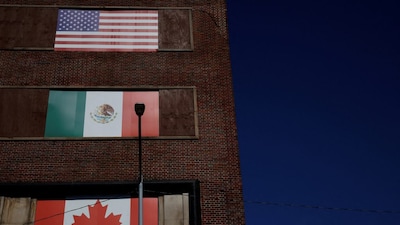 The flags of the United States, Mexico and Canada, all part of the USMCA which replaced NAFTA, on a building in Atlanta, Georgia, US. File/Reuters